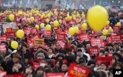 FILE - Protesters shout slogans during a rally against the impeached South Korean President Park Geun-hye in downtown Seoul, South Korea, Dec. 17, 2016.