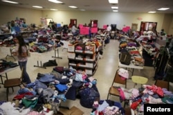 FILE - A general view shows the Sacred Heart Catholic Church temporary migrant shelter in McAllen, Texas, June 27, 2014.