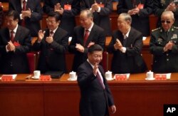 Chinese President Xi Jinping arrives for the opening session of China's 19th Party Congress at the Great Hall of the People in Beijing, Wednesday, Oct. 18, 2017.