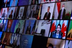 World leaders appear on screen during a virtual Climate Summit, seen from the East Room at the White House in Washington, U.S., April 22, 2021. (REUTERS/Tom Brenner)