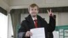 Independent mayoral candidate Yevgeny Urlashov casts his vote at a polling station in the city of Yaroslavl, some 250 kilometers (160 miles) northeast of Moscow April 1, 2012. 