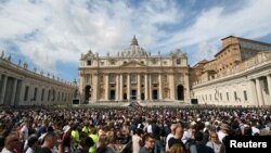 The faithful gather in front of St. Peter's Basilica as Pope Francis leads the Regina Coeli prayer in Saint Peter's Square at the Vatican, Sept. 17, 2017.