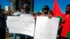 FILE - People protest in Windhoek, Namibia, May 28, 2021. Germany had just reached an agreement with Namibia to officially recognize as genocide the colonial-era killings of tens of thousands of people and commit to spending $1.3 billion, largely on development projects.