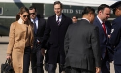 Hope Hicks, (L), an advisor to U.S. President Donald Trump, White House special assistant Nicholas Luna (2nd L), President Trump's senior adviser, Jared Kushner, and White House staffers depart Washington.