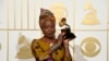 FILE - Angelique Kidjo, seen in this Feb. 15, 2016 photo with award for best world music album for "Sings" at the 58th annual Grammy Awards, has won a human rights award, along with three African youth activist movements, for their work defending freedom of expression and peaceful protest.