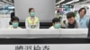 Hong Kong Chief Executive Carrie Lam, second from right, and Secretary for Food and Health, Prof. Sophia Chan, right, reviews the health surveillance by officers of the Port Health Division at West Kowloon Station in Hong Kong, Jan. 3, 2020.