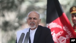 FILE - Afghan President Ashraf Ghani Ahmadzai talks during a news conference in Kabul, Oct. 3, 2014.