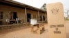 FILE - A sign for Ghana's Electoral Commission is seen at a polling station in Accra during a 2009 poll.