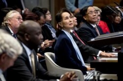 FILE - Myanmar State Counselor Aung and Foreign Minister Aung San Suu Kyi (C) is seen at the U.N.'s International Court of Justice in The Hague, Netherlands, Dec. 11, 2019.
