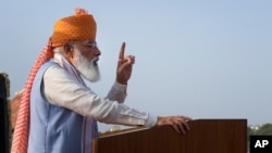 Indian Prime Minister Narendra Modi addresses the gathering during Independence Day celebrations at the historic 17th century Red Fort in New Delhi, India, on Aug. 15, 2021. 
