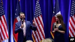 Donald Trump, Jr., left, and Trump campaign senior advisor Kimberly Guilfoyle, right, speak to supporters of President Donald Trump during a panel discussion, Oct. 15, 2019, in San Antonio.