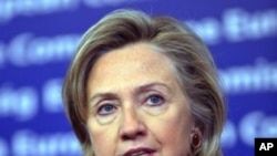 US Secretary of State Hillary Rodham Clinton answer reporters after a bilateral meeting at EU headquarters in Brussels, 14 Oct 2010