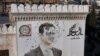 ARCHIVO - Esta fotografía aérea muestra un retrato acribillado a balazos del presidente sirio Bashar al-Assad adornando el edificio del municipio de Hama después de que fuera profanado tras la captura de la ciudad por combatientes antigubernamentales, el 6 de diciembre de 2024.