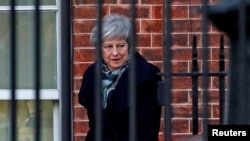Britain's Prime Minister Theresa May leaves 10 Downing Street in Westminster London, Dec. 13, 2018.