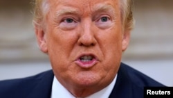 FILE - U.S. President Donald Trump speaks after John Kelly was sworn in as White House Chief of Staff in the Oval Office of the White House in Washington.