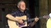 Master flatpicker Doc Watson performs at the annual Merlefest at Wilkes Comunity College in Wilkesboro, N.C. (2001 file photo)