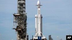 A Falcon 9 SpaceX heavy rocket stands ready for launch on pad 39A at the Kennedy Space Center in Cape Canaveral, Fla., Feb. 5, 2018.