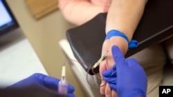 HealthBeat Kidney Transplants Hepatitis C: Irma Hendricks has blood drawn at the Hospital of the University of Pennsylvania in Philadelphia, on Oct. 6, 2016. Hendricks received a kidney transplant from a donor with hepatitis C, and took medications after surgery that cleared away the virus and left her feeling healthy again. Hendricks is part of a pilot study testing if new drugs that promise to cure most hepatitis C could allow use of organs that today go to waste, and speed transplants to people who might otherwise die waiting.