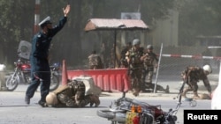 Taliban fighters patrol inside the city of Ghazni, southwest of Kabul, Afghanistan, and it&#39;s at least the 10th provincial capital the insurgents have taken in the past recently across the country.