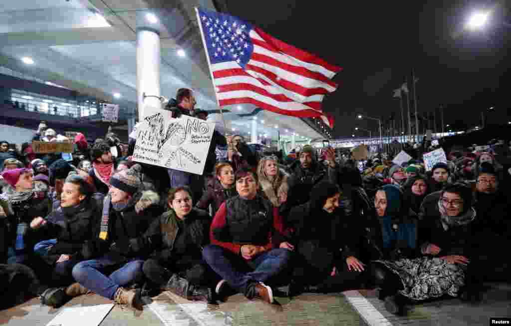 People gather to protest against the travel ban imposed by U.S. President Donald Trump's executive order, at O'Hare airport in Chicago, Illinois, Jan. 28, 2017.