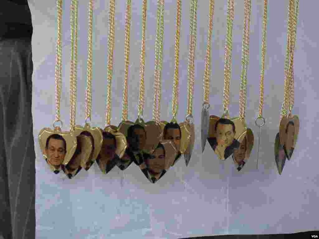 Necklaces with Mubarak picture on display in front of Maadi Military hospital in 2015. (Photo: Hamada Elrasam / VOA)