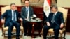 Egyptian President Mohamed Morsi (R) meets with Turkish President Abdullah Gul after he arrived at the Cairo International Airport February 5, 2013.
