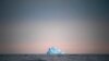 A large iceberg floats away near Kulusuk, Greenland, on Aug. 15, 2019. (AP Photo/Felipe Dana)