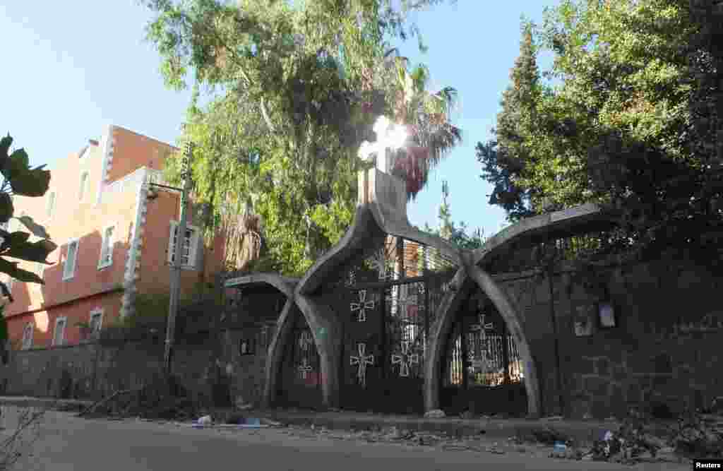 The entrance of a cathedral is seen after fighting between Syrian rebel fighters and President Bashar al-Assad's forces in Hamidiyeh, Homs, Syria, July 1, 2012.