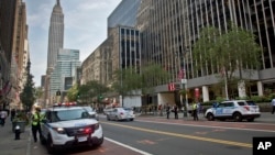 FILE - New York police prepare a vehicle checkpoint on 34th Street, in New York. 