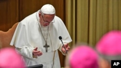 Pope Francis prays at the opening of a sex abuse prevention summit, at the Vatican, Feb. 21, 2019.
