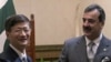 Chinese Public Security Minister Meng Jianzhu, left, shakes hands with Pakistan's Prime Minister Yusuf Raza Gilani in Islamabad, Pakistan on Tuesday, Sept 27, 2011.