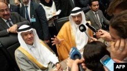 FILE - In this photo taken July 01, 2019, Saudi Arabia's Energy Minister Khaled al-Falih (R) and Saudi Deputy Oil Minister Prince Abdulaziz bin Salman bin Abdulaziz talk to the press on the sidelines of an oil meeting in Vienna, Austria.