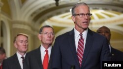 FILE - Republican U.S. Senator John Thune, who was elected to become the next Senate majority leader, speaks to reporters on Capitol Hill in Washington, Nov. 13, 2024.