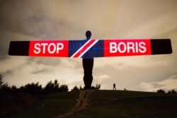 Anti-Brexit and anti-Boris Johnson messages are projected onto the Angel of the North sculpture in Gateshead, England, Sept. 3, 2019, in this picture obtained from social media on Sept. 4, 2019.