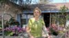  Pamela Taylor stands outside her ranch home in Brownsville, Texas, where she has lived for nearly 70 years. Following the 2006 Secure Fence Act, a barrier was built to her north, with an opening just big enough for two-lane traffic. (R. Taylor/VOA)