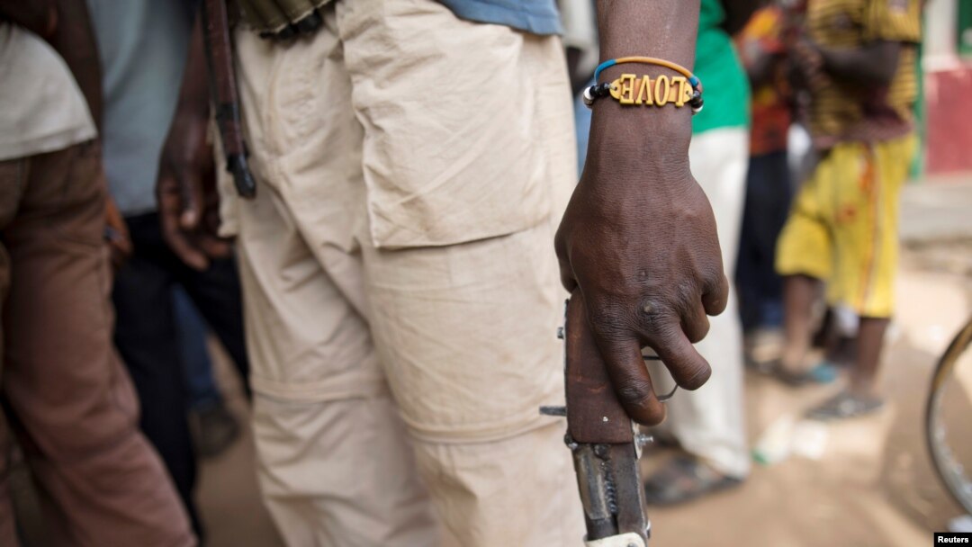 FILE - A member of the of an Anti-Balaka armed militia displays his weapon in the town of of Bocaranga, Central African Republic, April 28, 2017.