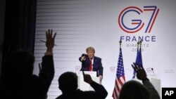 President Donald Trump takes questions during a press conference on the third and final day of the G-7 summit in Biarritz, France, Aug. 26, 2019.