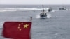 Barcos pesqueros chinos navegan en una laguna cercana a la isla provincia de Hainan, en el Mar del Sur de China, en julio del 2012.