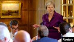 Britain's Prime Minister Theresa May commences a meeting with her cabinet to discuss the government's Brexit plans at Chequers, the Prime Minister's official country residence, near Aylesbury, Britain, July 6, 2018. 