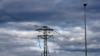 FILE - Migratory birds, headed towards Africa, perch on electrical cables in Cambrils near Tarragona.