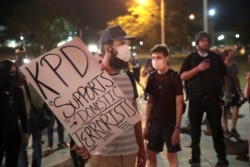 Demonstrators protests the shooting of Jacob Blake on Aug. 26, 2020, in Kenosha, Wis.