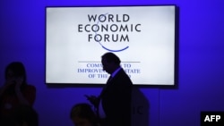 Participants and visitors arrive at the India Economic Summit, hosted by the World Economic Forum, in New Delhi on October 6, 2017.