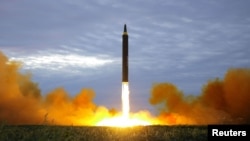 A missile is launched during a long and medium-range ballistic rocket launch drill in this undated photo released by North Korea's Korean Central News Agency (KCNA) in Pyongyang, Aug. 30, 2017.