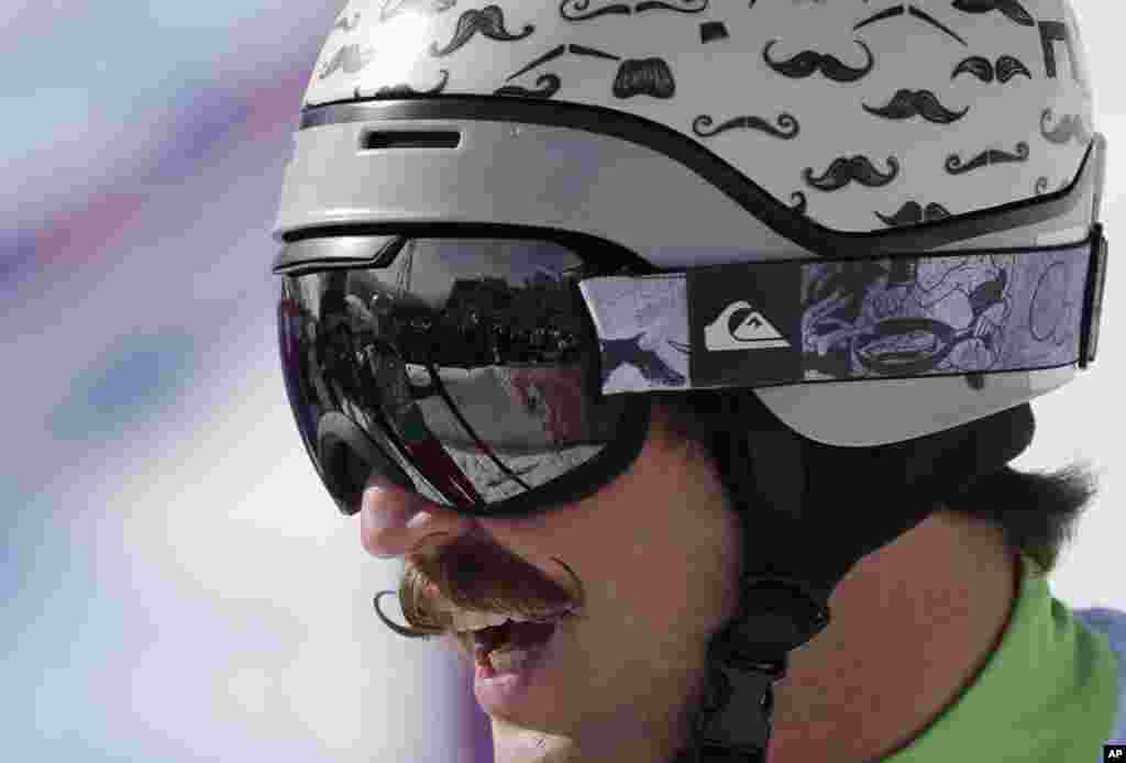 Slovenia's Filip Flisar wears his distinctive moustache helmet during men's ski cross competition at the Rosa Khutor Extreme Park, Krasnaya Polyana, Russia, Feb. 20, 2014.