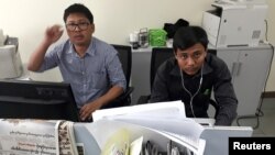 FILE - Reuters journalists Wa Lone, left, and Kyaw Soe Oo, who are based in Myanmar, are seen at the Reuters office in Yangon, Myanmar, Dec. 11, 2017. 