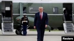 U.S. President Donald Trump walks from the Marine One presidential helicopter prior to departing O'Hare International Airport in Chicago, Illinois, U.S., Oct. 28, 2019.