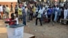 FILE - A man casts his vote at a polling station during presidential elections in Accra, Dec. 7, 2012. 