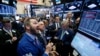 Traders work on the floor of the New York Stock Exchange (NYSE) the morning after the U.S. presidential election in New York City, Nov. 9, 2016. 