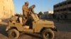 Anti-government fighters inspect a base belonging to the Iran-backed Fatemiyoun Brigade in the town of Khan Sheikhun, in the northwestern Syrian Idlib province, Dec. 1, 2024.