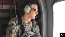 FILE - U.S. Army Lt. Gen. Stephen Townsend watches during a tour north of Baghdad, Iraq, In this eb. 8, 2017.